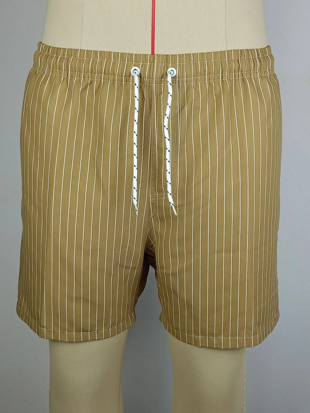 Men's striped beach shorts in navy blue, made from polyester fibre with a straight leg opening.