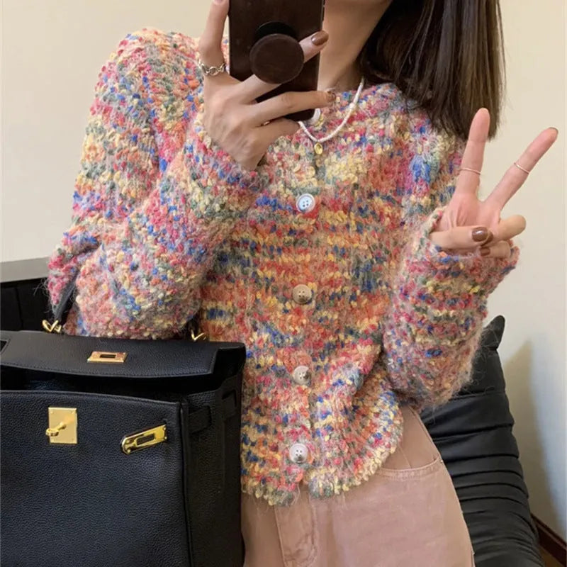 Retro slim fit pink knitted cardigan with regular sleeves on a hanger