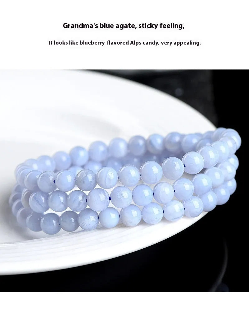 Blue agate bracelet with natural multi-circle pattern and Ruyi elements on wrist