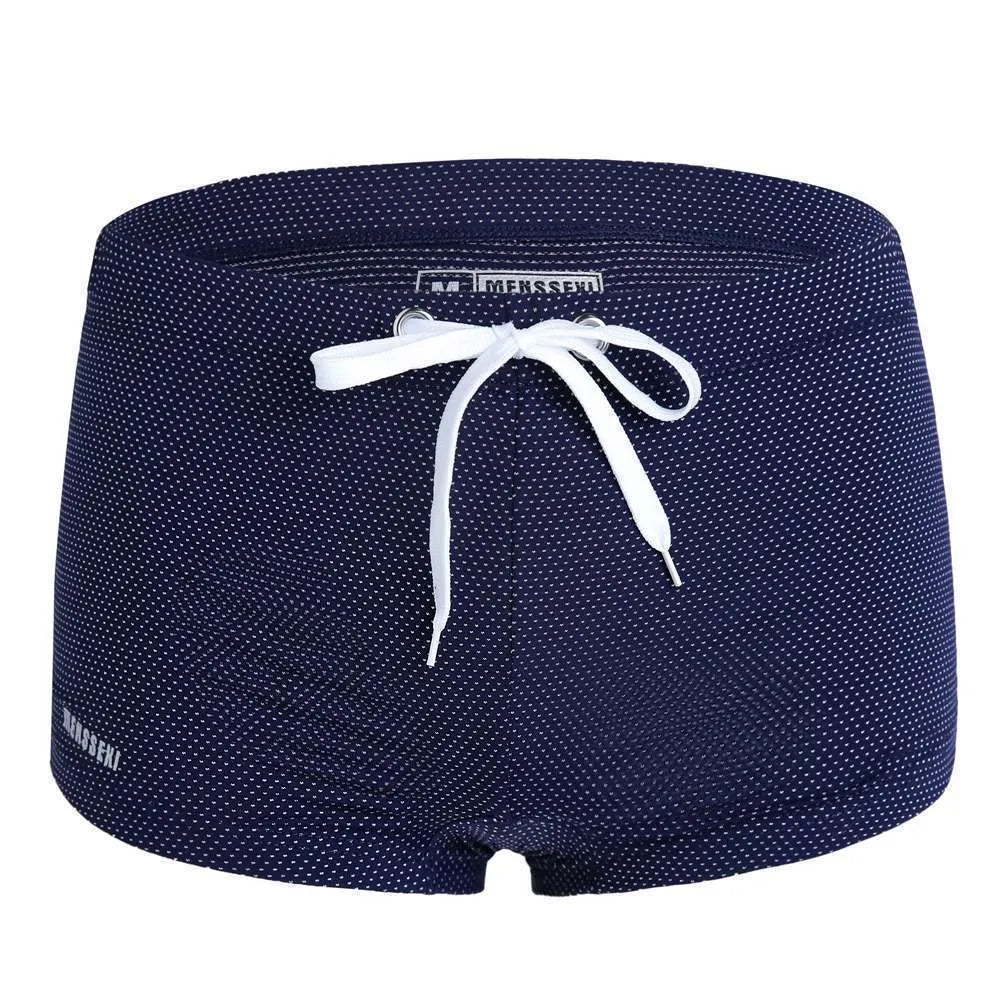 Men's low-waist boxer style swimming trunks with lace detailing in nylon fabric