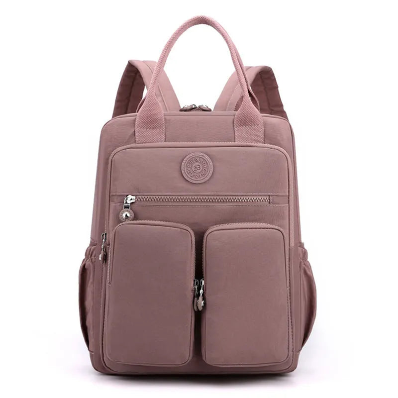 Women's waterproof nylon travel backpack with multiple internal compartments in various colours