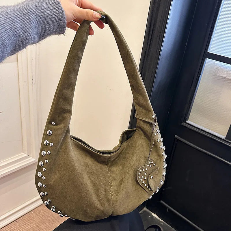 Strapless soft plush underarm tote handbag in a retro style, shown in one of its colour options.