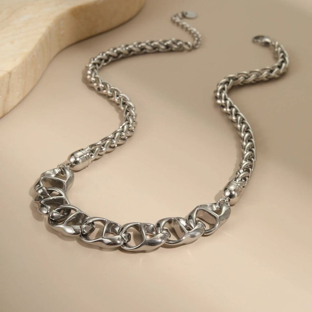 Gold electroplated stainless steel necklace with geometric pendant on regular chain