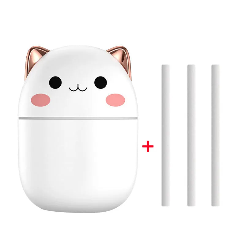 Cute cat-shaped USB air humidifier with LED cool mist spray in white, for office and bedroom use.