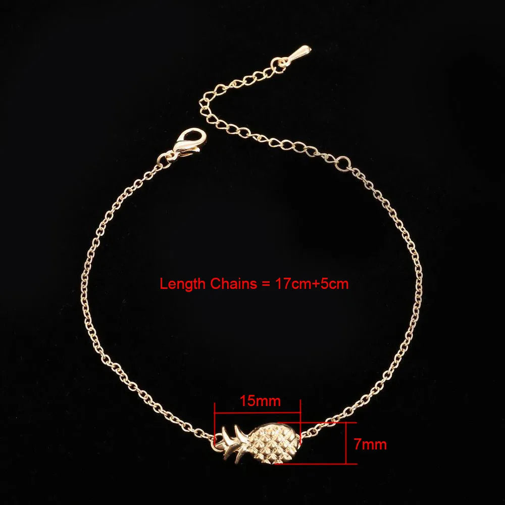 Women's alloy bracelet featuring a central pineapple charm in gold or silver colour.