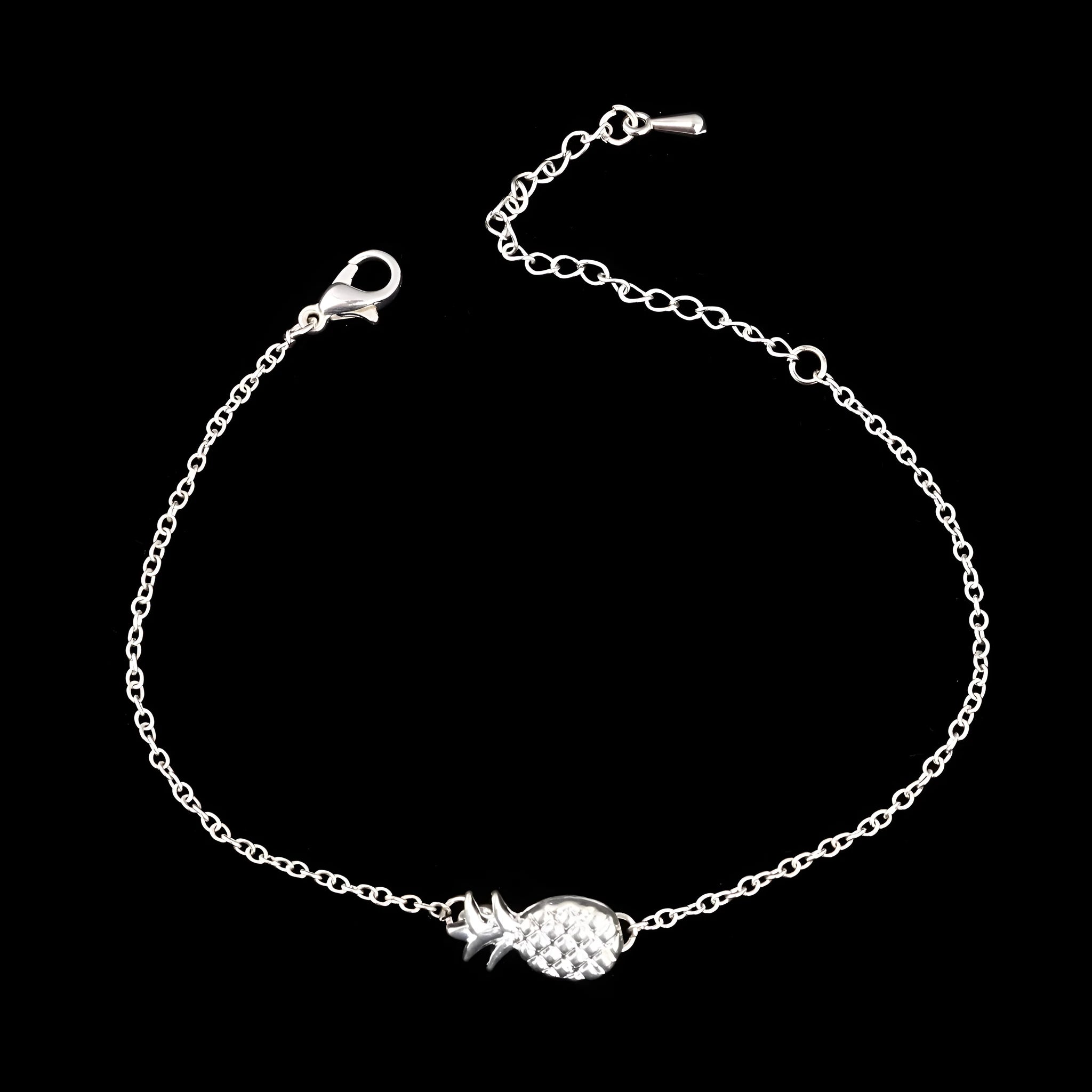 Women's alloy bracelet featuring a central pineapple charm in gold or silver colour.
