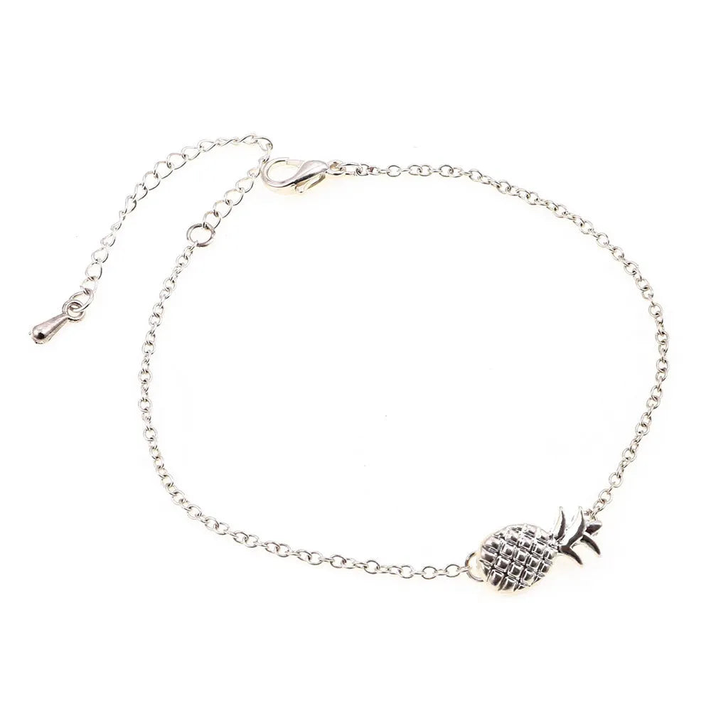 Women's alloy bracelet featuring a central pineapple charm in gold or silver colour.
