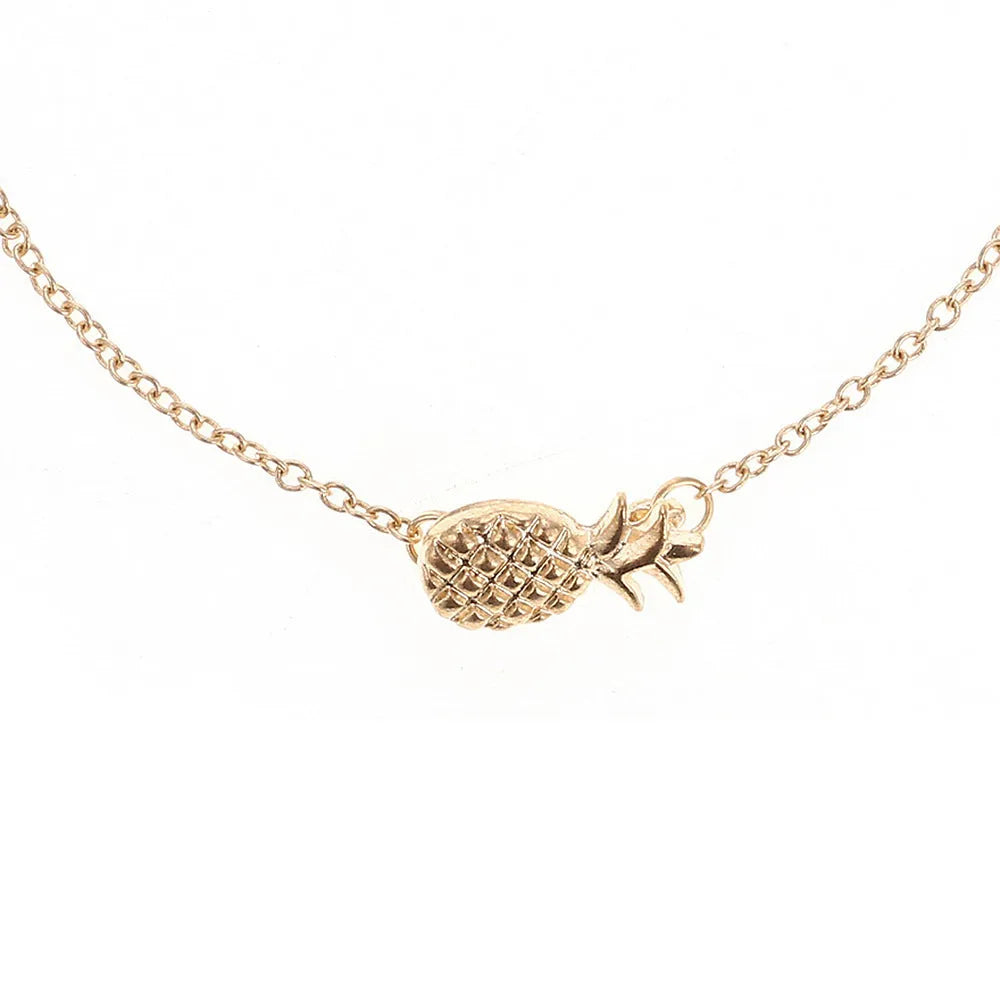 Women's alloy bracelet featuring a central pineapple charm in gold or silver colour.