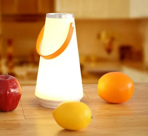 White rechargeable LED bedside lantern with USB cable, showing compact columnar design