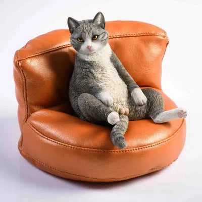 Small 7.5cm lazy cat ornament with sofa on car dashboard