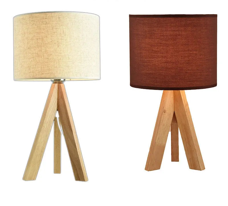 Japanese style solid wood table lamp with fabric lampshade in linen trumpet colour on bedside table