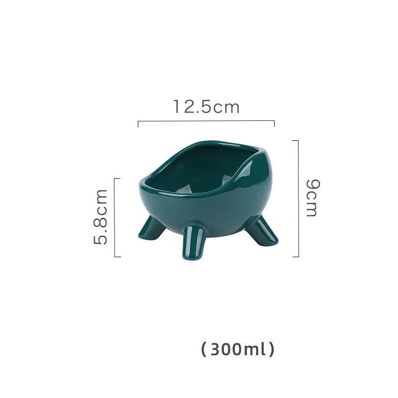 Green four-legged ceramic cat food bowl for indoor pets with wide mouth design