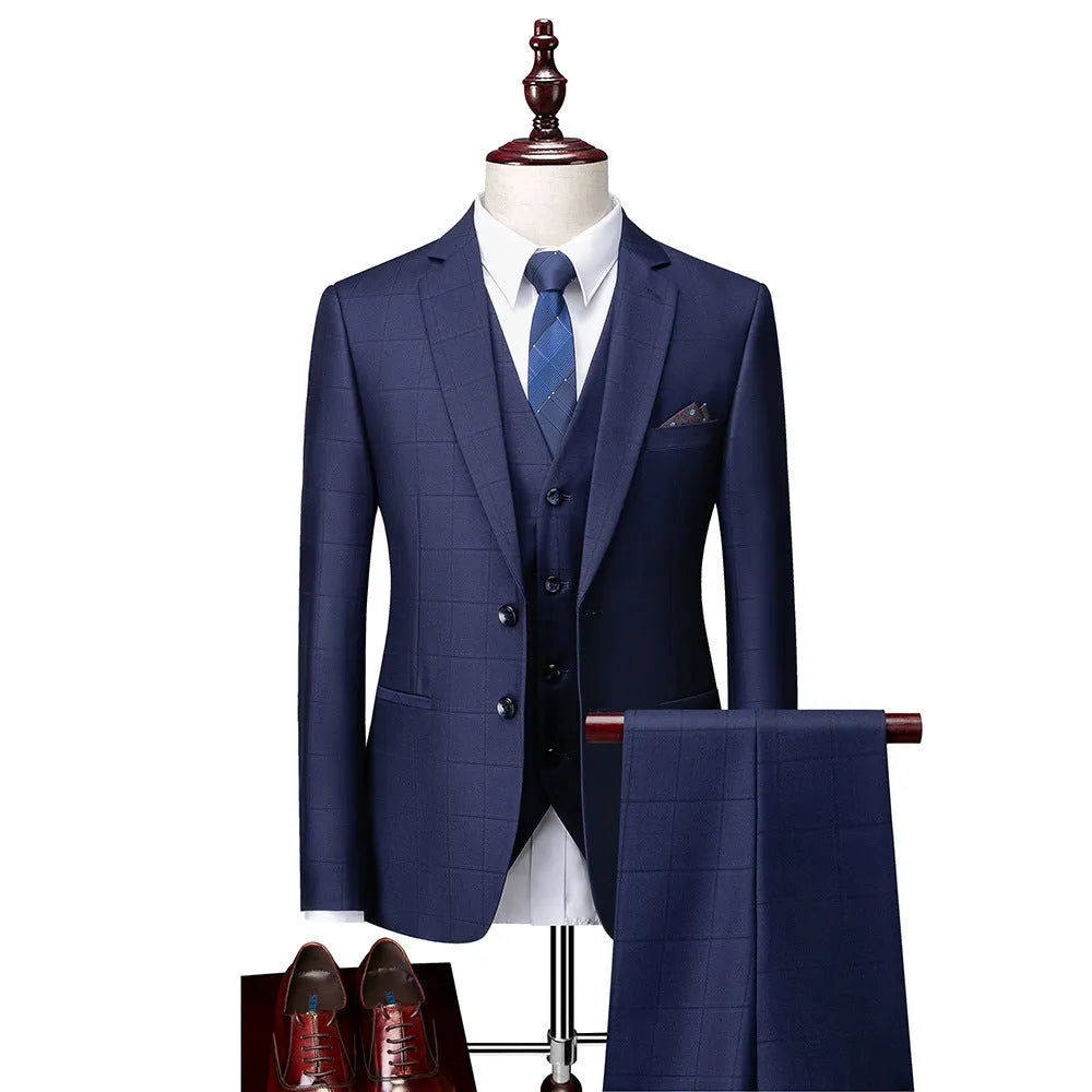 Men's navy blue plaid slim fit three-piece suit showing vest, jacket and trousers