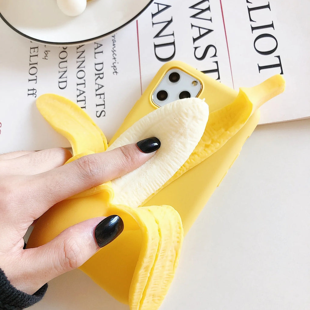 Yellow banana-coloured IMD back cover case for iPhone models 6 through 13 Pro Max on a table.