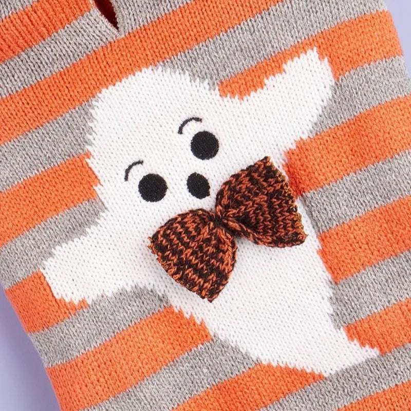 Orange striped knitted Halloween pet sweater with a hood and fur ball decoration for cats or small dogs.