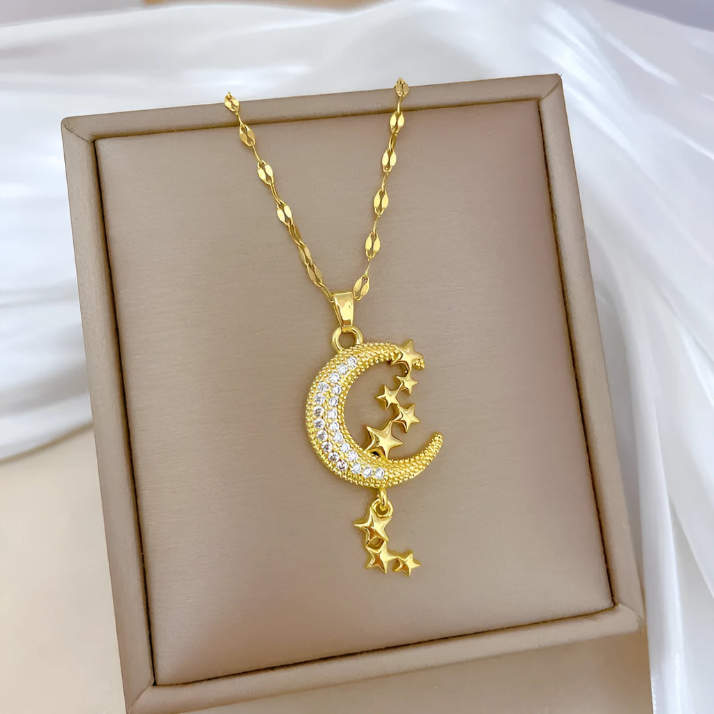 Stainless steel and copper moon pendant necklace with geometric diamond pattern and tassel design
