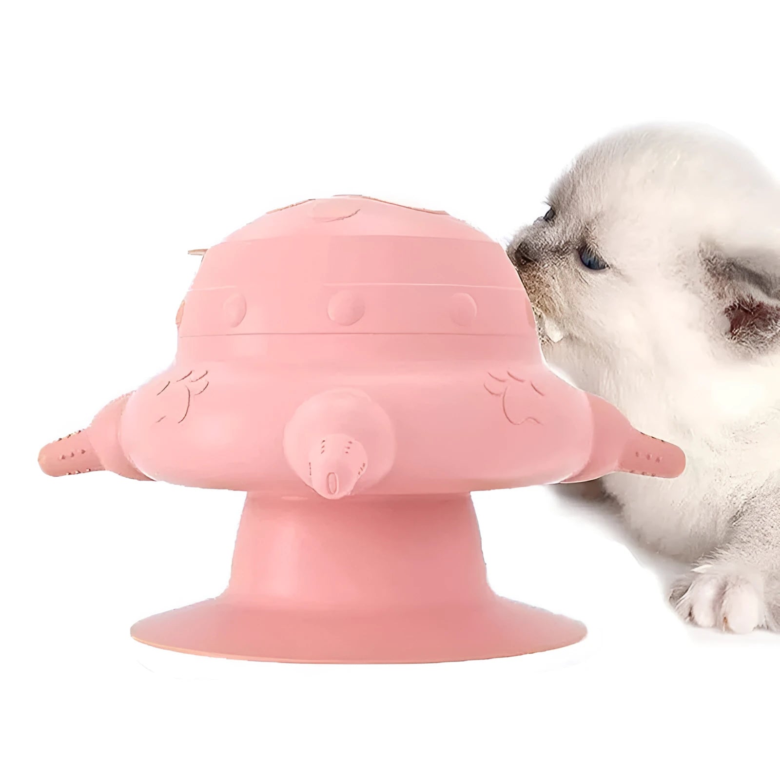 Pink silicone pet nursing feeder with bionic breast-shaped bowl and four pacifiers on a white background.