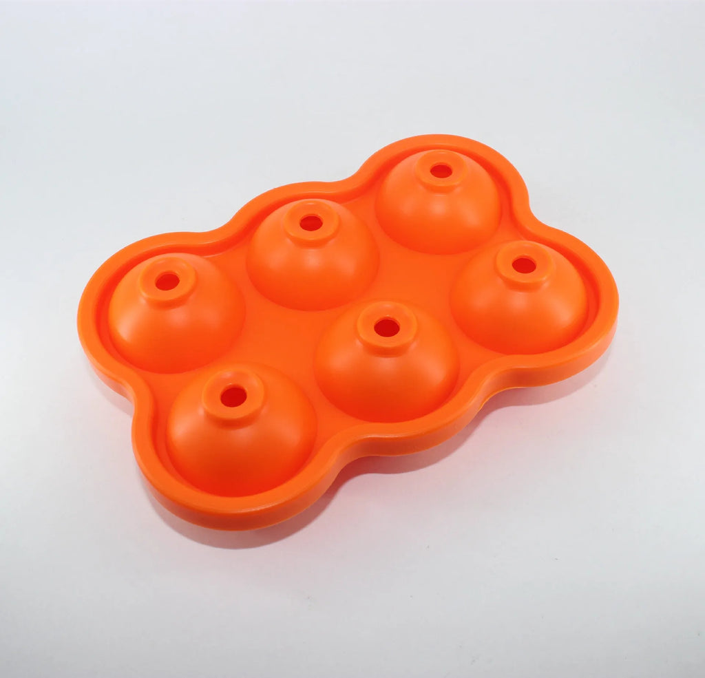 Large black silicone ice cube maker with six 4.5cm sphere cavities on a white background