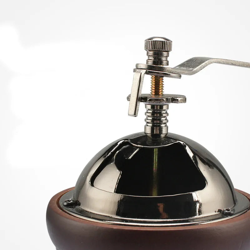 Solid wood barrel manual coffee grinder with hand crank in natural coffee colour