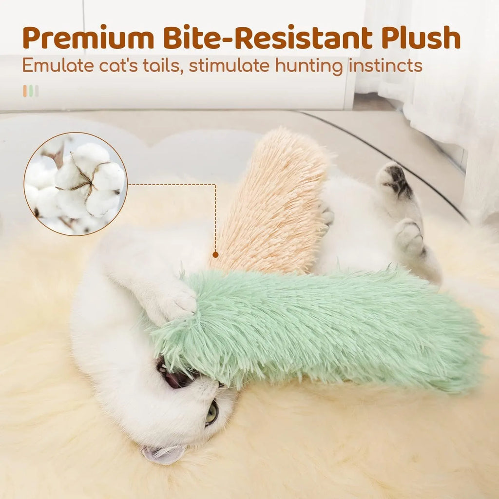 Green, white, blue, and pink plush cat toy pillow measuring 27 by 10 centimetres.