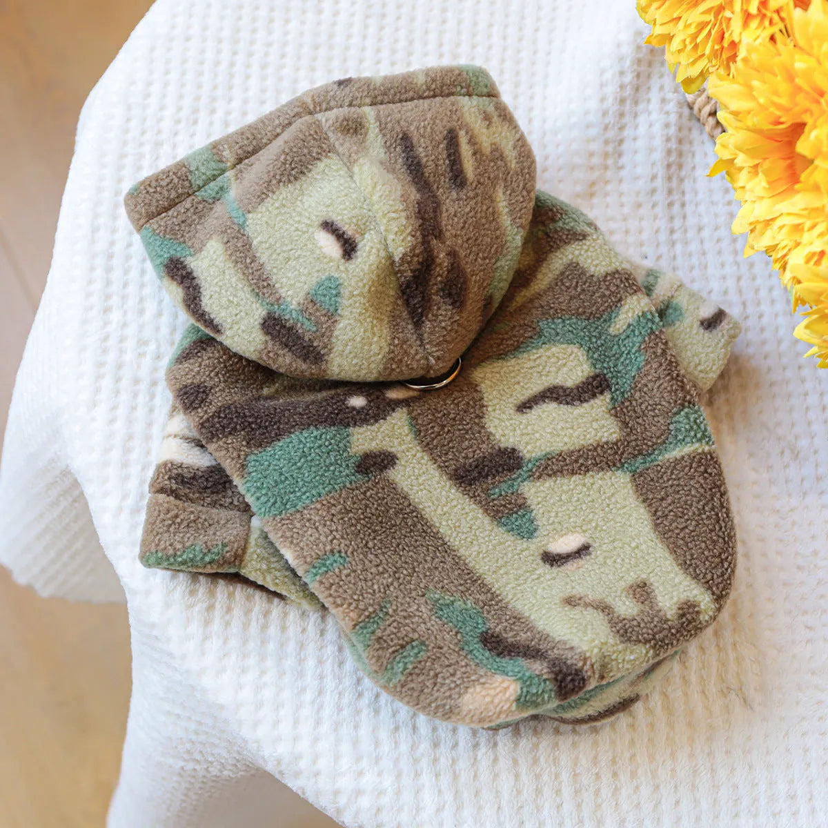 Camouflage dog sweater on a light background, showing full-body style with ribbed hem