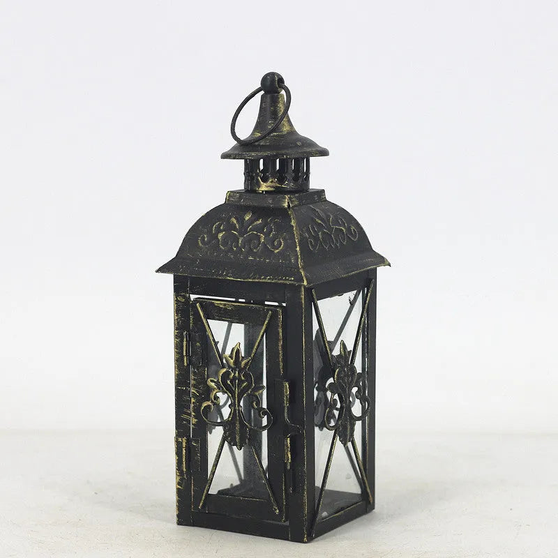 Black and white gold wrought iron storm lantern with tempered glass in three sizes for courtyard decoration.
