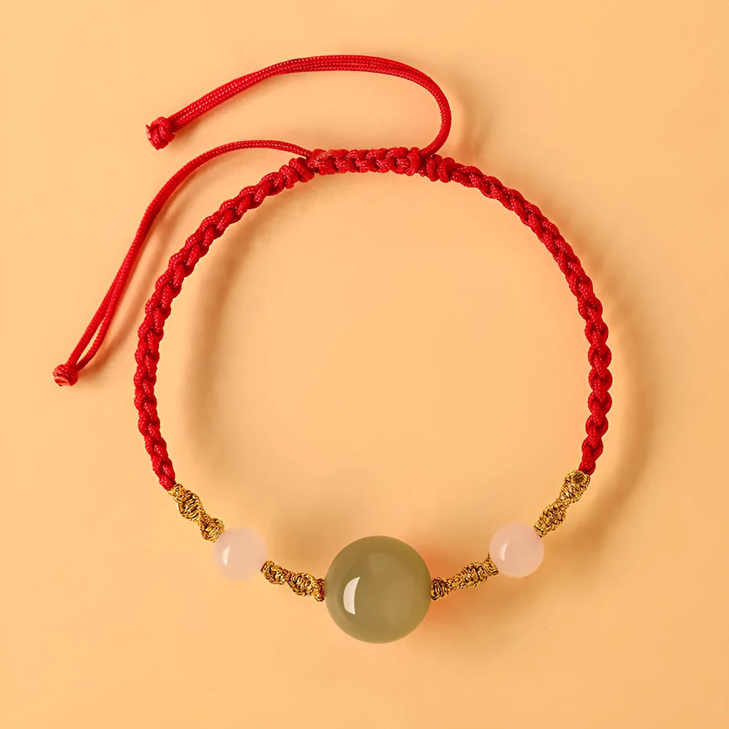 Hand-woven red rope bracelet with Hetian jade lucky beads and Chinese motif carvings