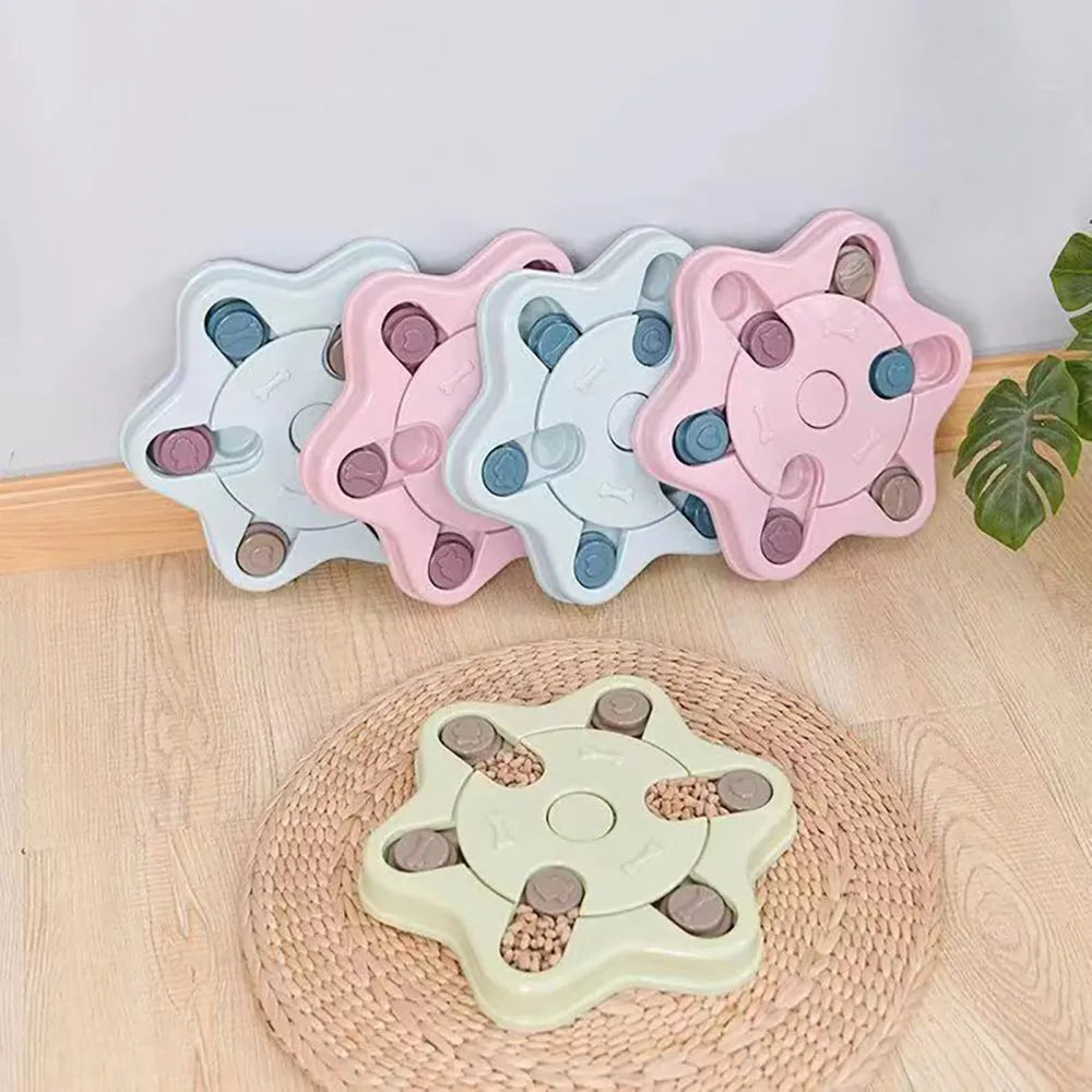 Educational dog toys anti choke dog bowl in pink plastic with non-slip bottom on a wooden floor