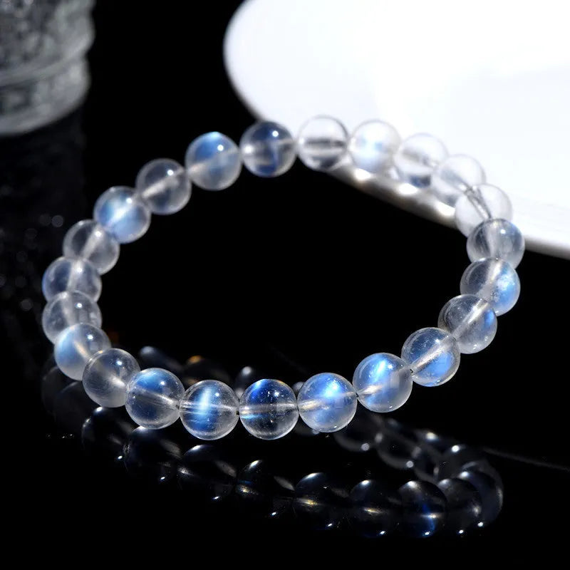 Natural cream body blue moonlight crystal bracelet with minimalist design showing ground finish stone
