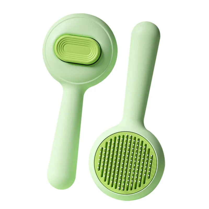 Green and yellow cat brush with stainless steel teeth and non-slip handle