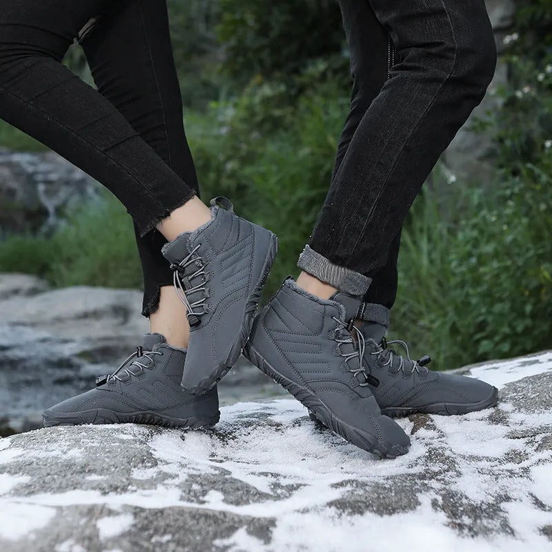 Outdoor winter slip-on boots for men and women with non-slip rubber sole, artificial plush lining, and waterproof Oxford cloth upper in black colour