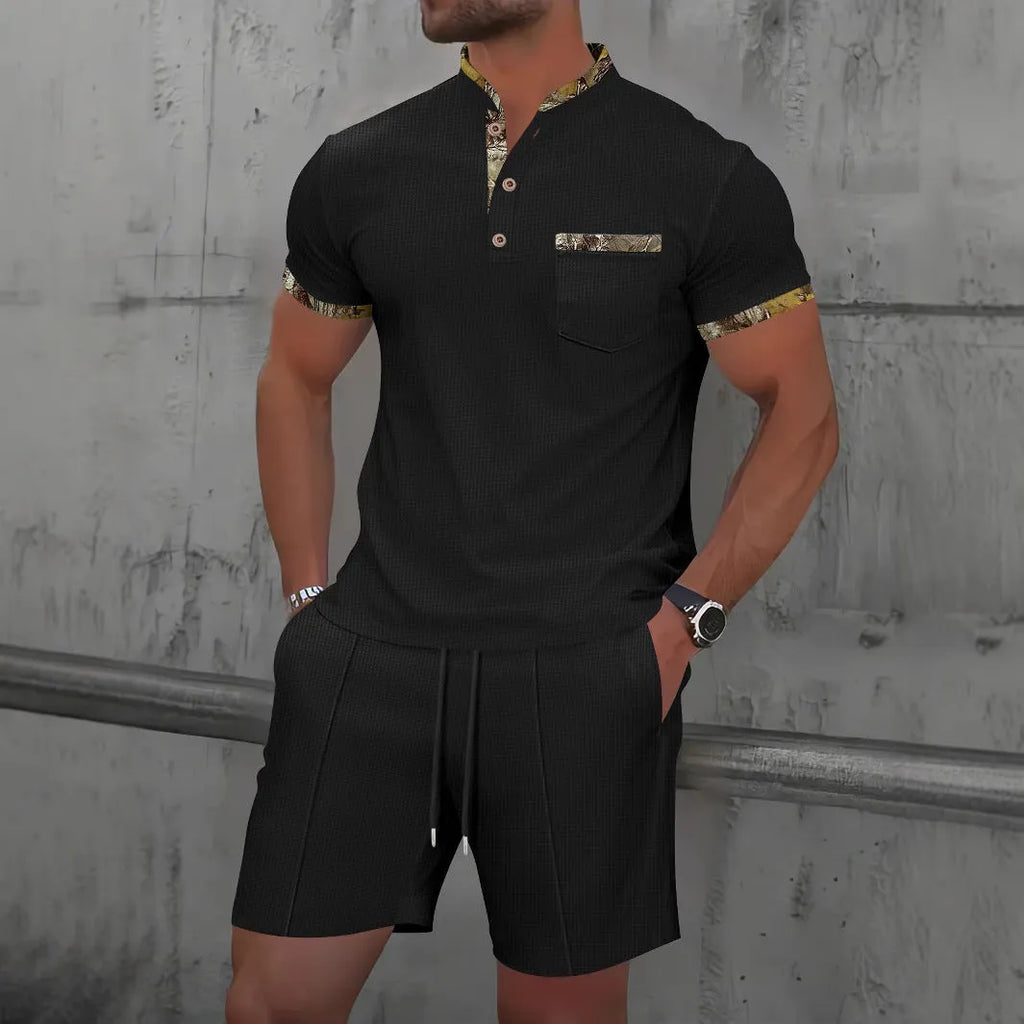 Men's grey waffle polo collar short sleeve suit top and shorts laid flat.