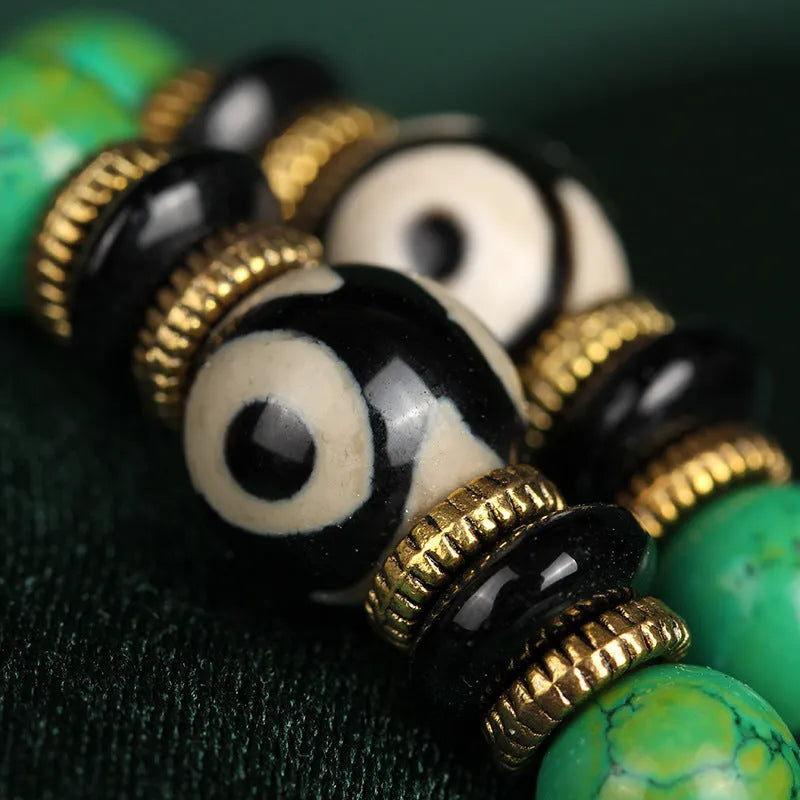 Natural raw turquoise bracelet with 108 round 8mm beads on a wrist, showing polished stone and national style design.
