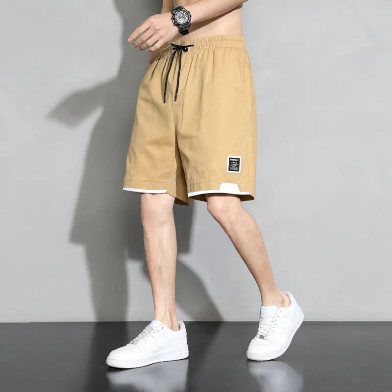 Boys cotton shorts in black, shown in a casual setting for summer.