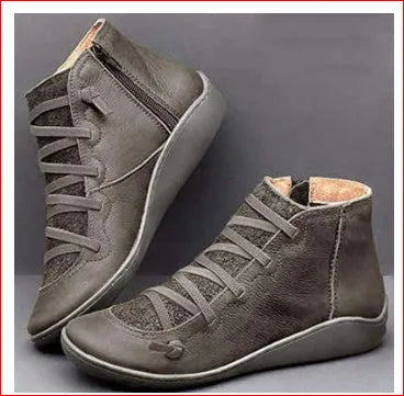 Women's casual ankle booties with a round toe, wedge heel, PU upper, and rubber sole in a selection of colours.