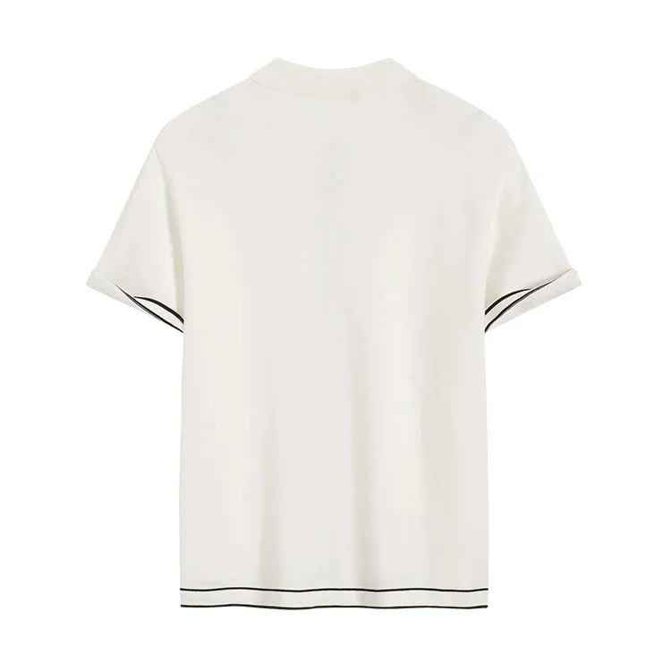 White short sleeve cardigan with dark contrast colour lapels laid flat.