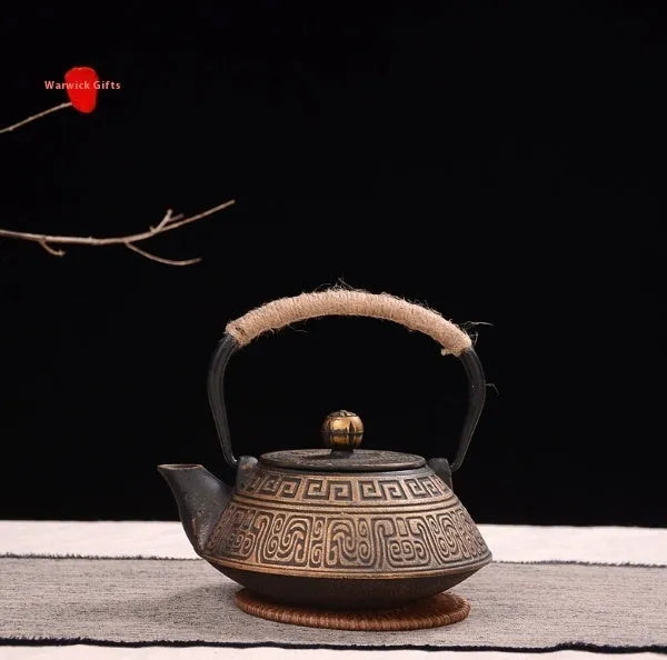 Japanese-style cast iron teapot with traditional decorative patterns and 0.9 litre capacity