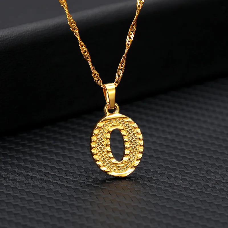 Gold-plated alloy initial pendant necklace with 42cm chain on white background