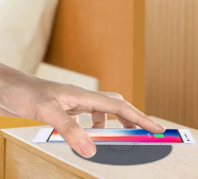 Round 60mm hidden wireless phone charger for installation in furniture.