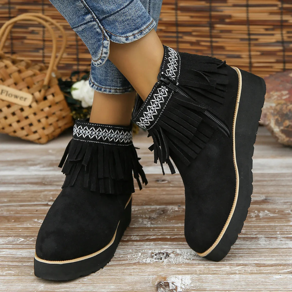 Women's dark brown suede wedge bootie with side zip, tassel detail, and thick rubber sole
