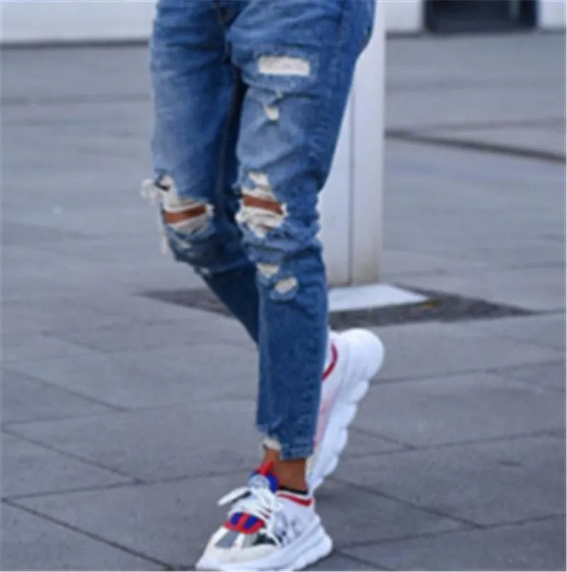 Men's distressed jeans with holes in deep blue colour showing cotton denim construction and sizing options from S to 3XL