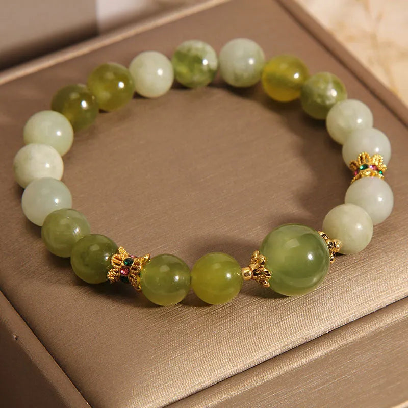 Women's green Xiuyan jade bracelet with an original sweet Mori style design.