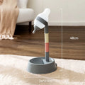 Green adjustable pet water dispenser showing height adjustment bars and ball-tip drinking nozzle