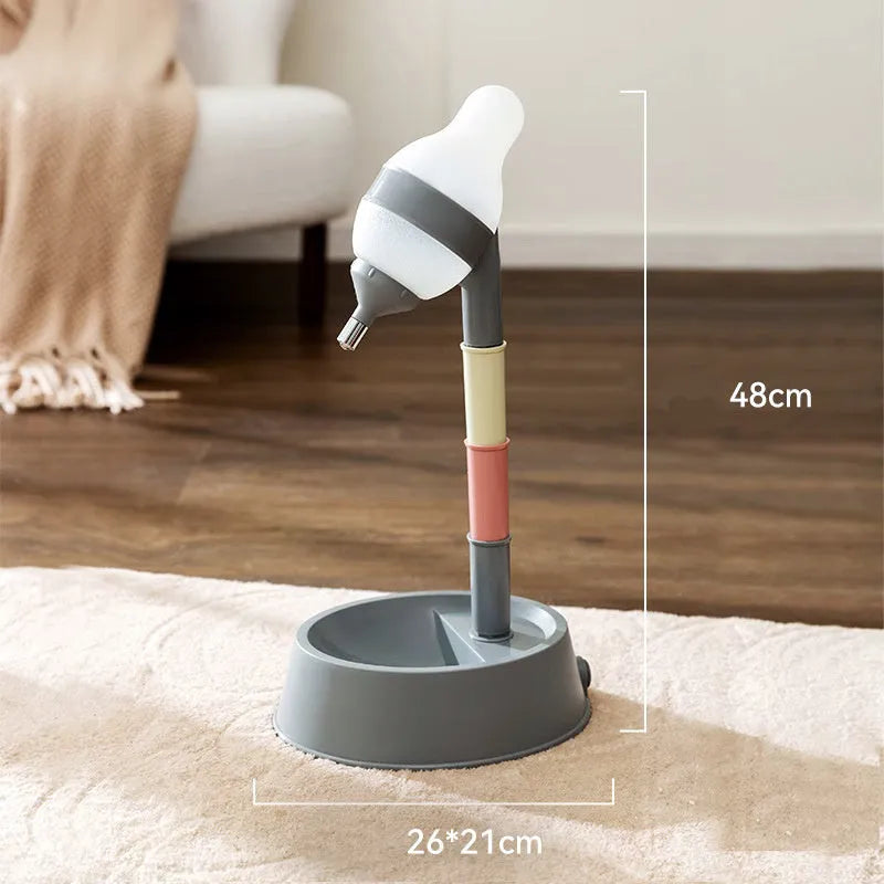 Green adjustable pet water dispenser showing height adjustment bars and ball-tip drinking nozzle