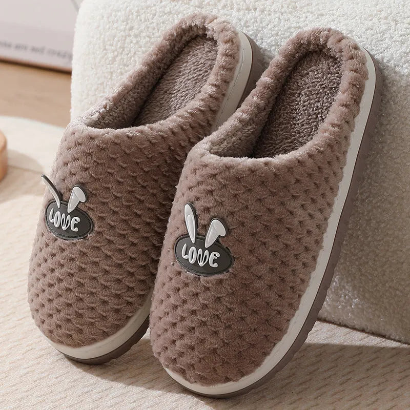 Rabbit plaid pattern women's house slippers with artificial fur upper and rubber sole.