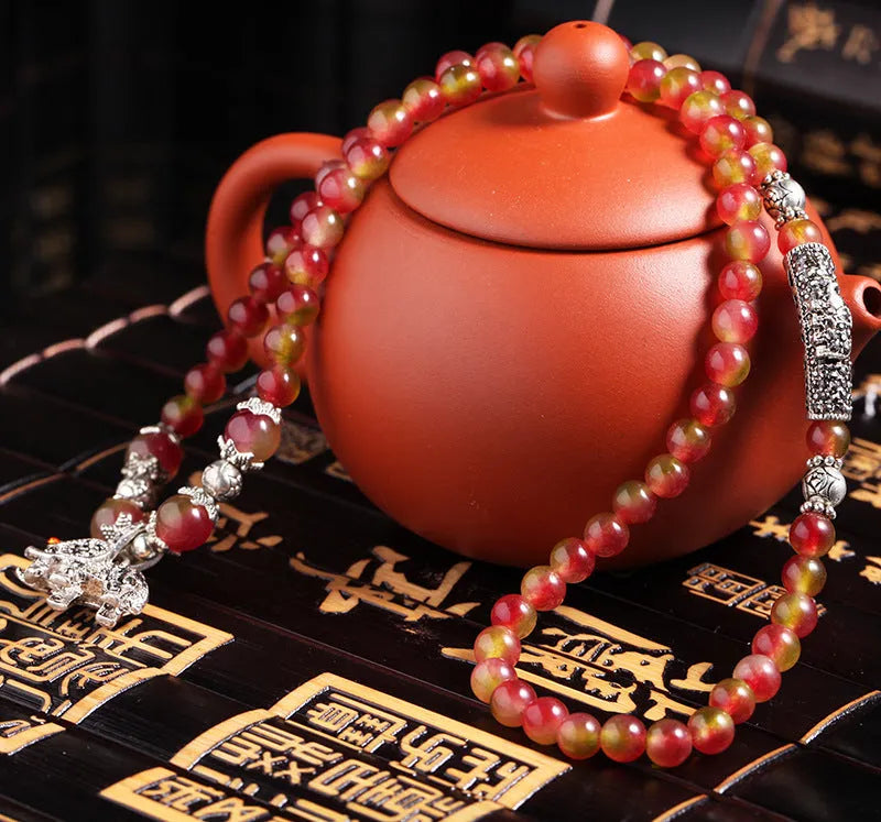 Handmade watermelon crystal bracelet with Chinese knot closure in elephant style design