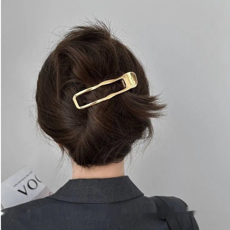 Gold and silver zinc alloy hair clips in arc, square, and triangle geometric shapes