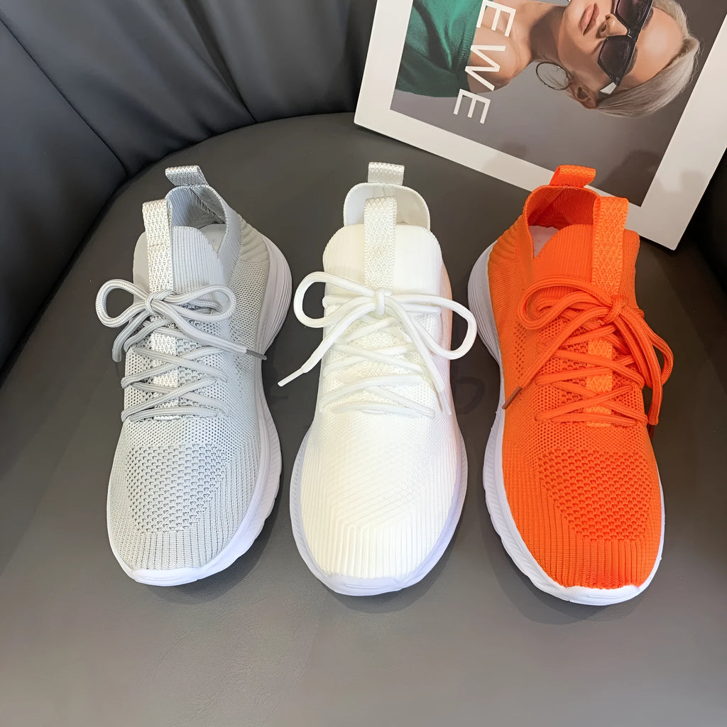 Women's Flyknit running shoes in Creamy White with mesh lining and rubber sole