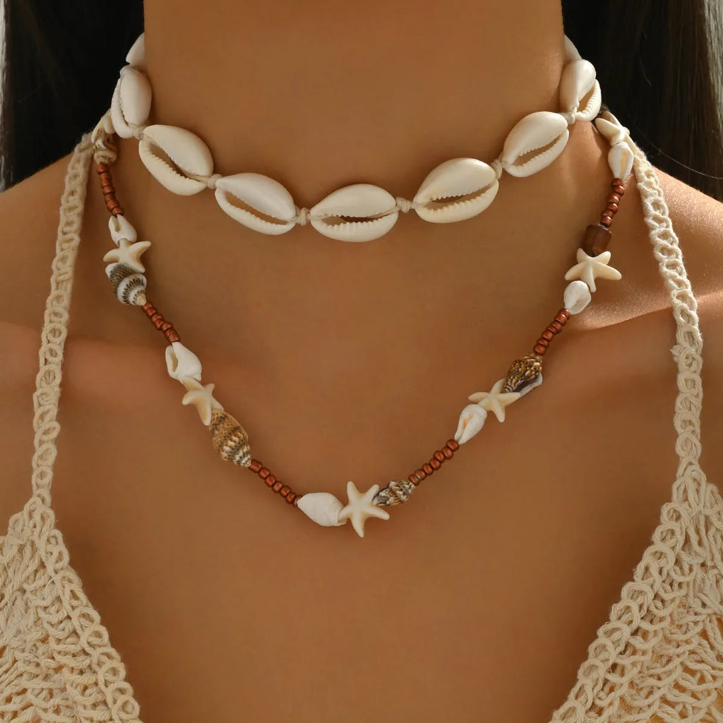 Natural shell geometric pendant necklace for women, handcrafted, bohemian style, colour X1900, on a regular chain.