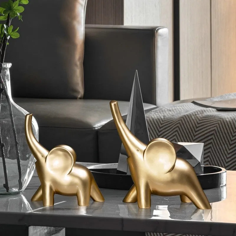 Minimalist solid resin elephant ornament in rose gold on a shelf.